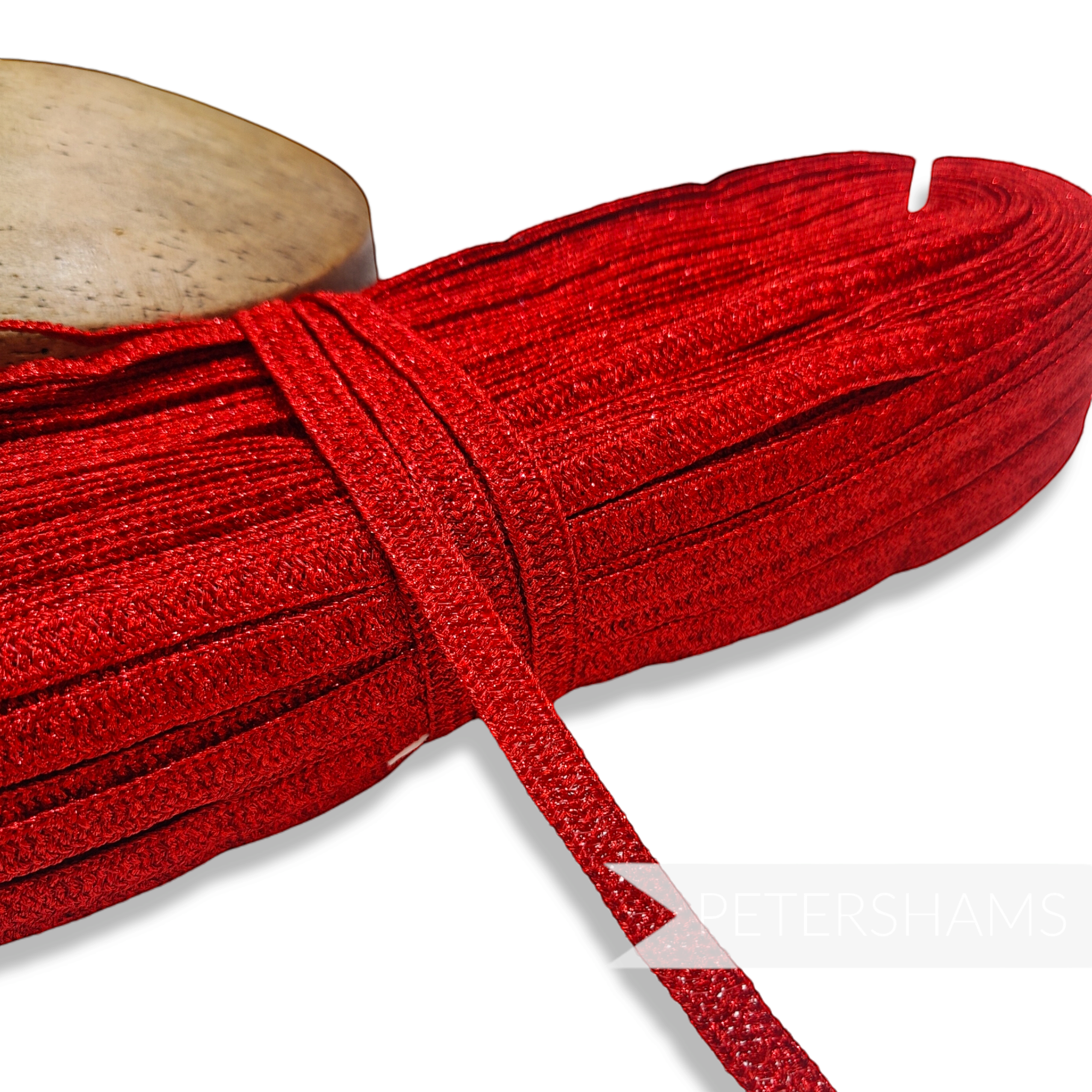 Petershams Millinery Supplies 10mm red sparkly lurex threaded hat braid with a zig-zag texture for millinery projects.