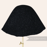 Petershams Millinery Supplies black wool felt cone hat body with ivory confetti fur strands for hat making.