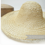 Petershams Millinery Supplies natural undyed straw and twisted paper cord capeline hat body with open weave design.