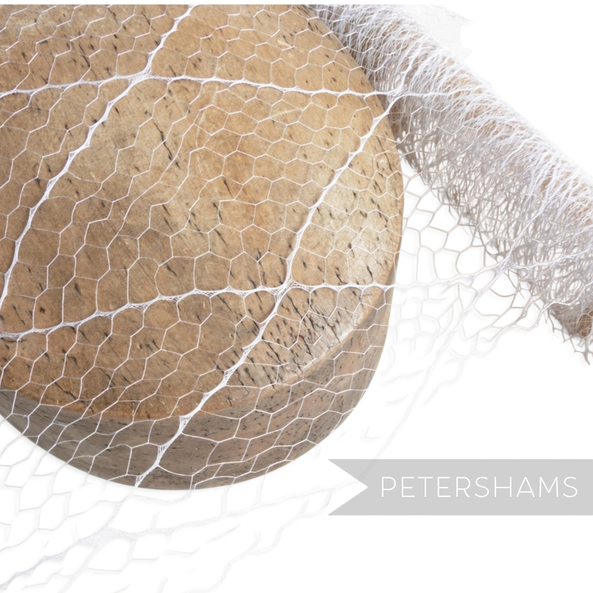 Petershams Millinery Supplies vintage 1940s white fine honeycomb veiling with a diamond pattern draped over a wooden block