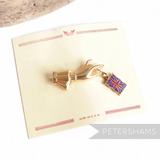 Petershams Millinery Supplies vintage 1940s gold-tone hand brooch dangling a Union Jack flag on original backing card.