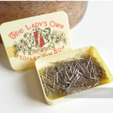 Petershams Millinery Supplies vintage 1960s Lady's Own toilet pin box with silver sewing pins in a cream plastic case