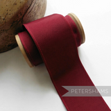 Petershams Millinery Supplies 53mm wide deep red ribbed belting ribbon on a wooden spool for millinery and crafts