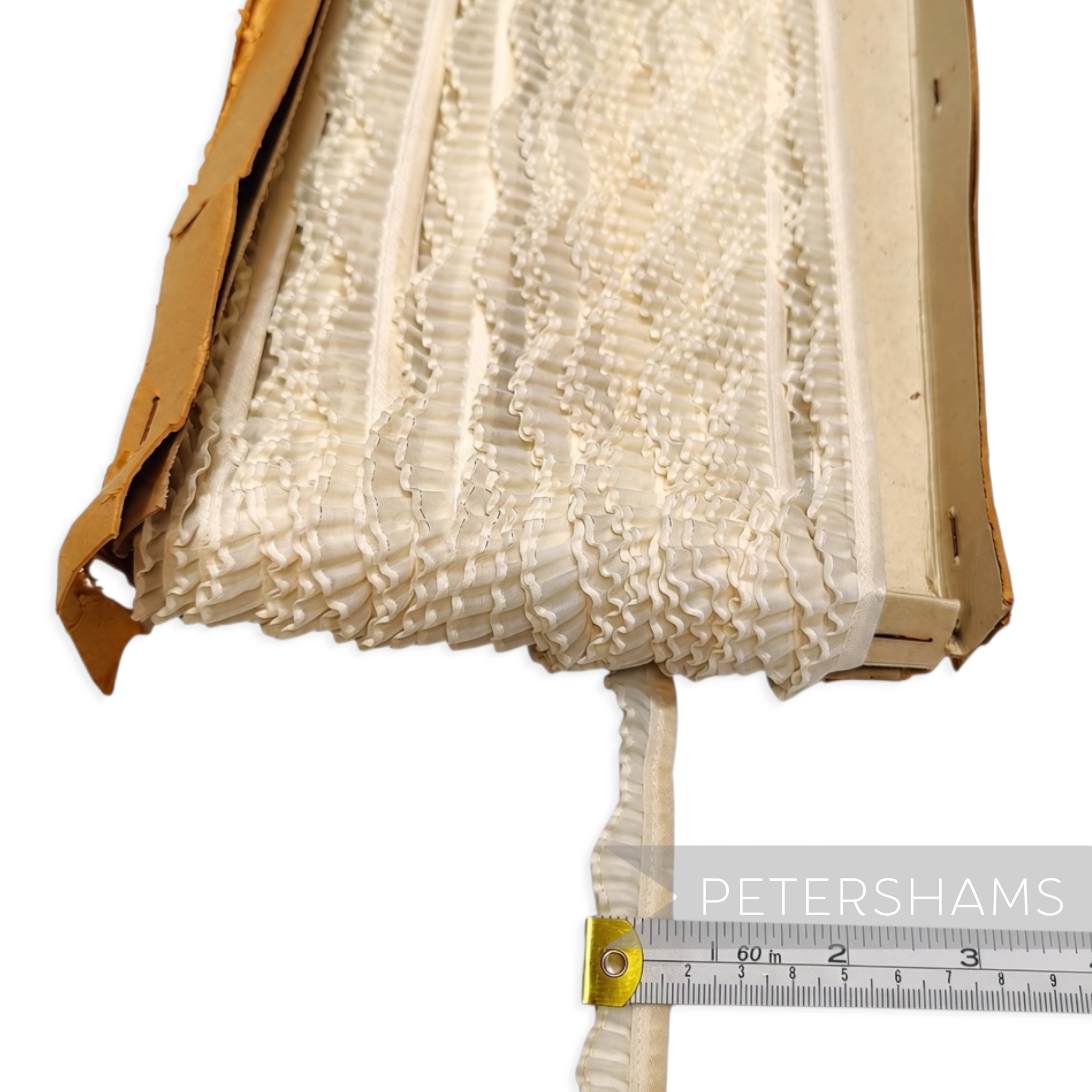 Petershams Millinery Supplies vintage 1950s petite pleated organza trim with a wavy edge on a cardboard spool.