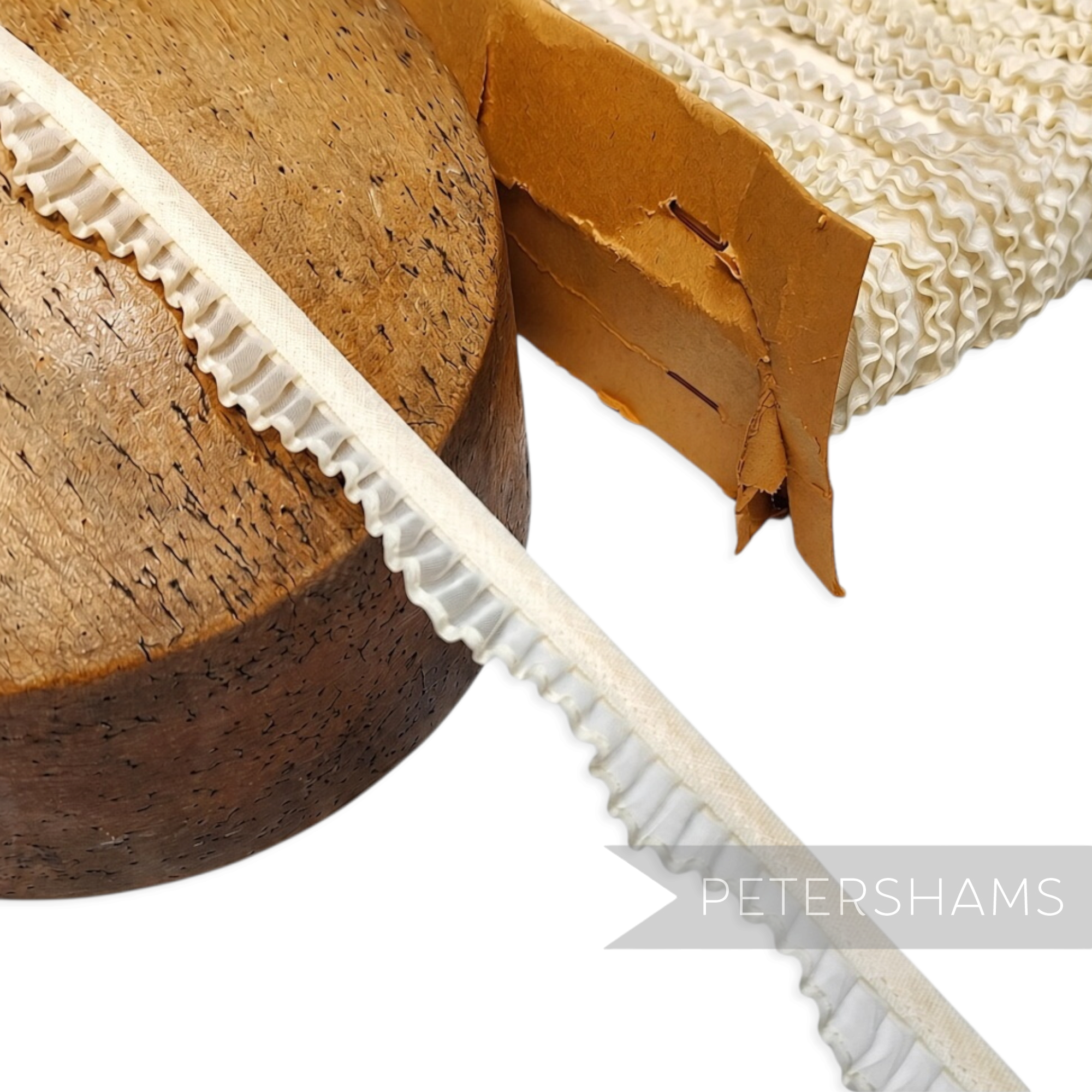 Petershams Millinery Supplies vintage 1950s white organza pleated trim with a wavy edge on a wooden hat block