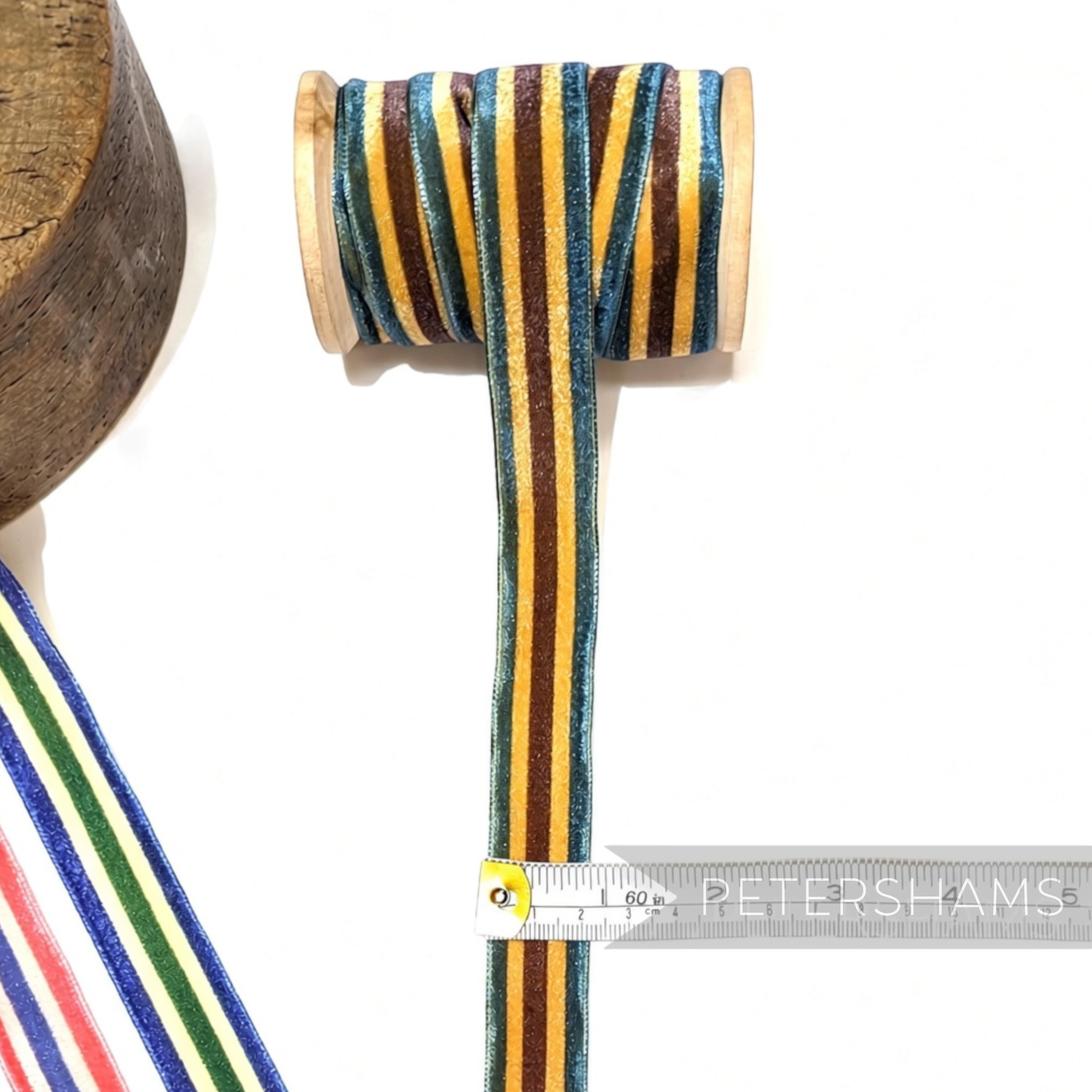 Petershams Millinery Supplies 23mm striped French velvet ribbon in blue, brown, and yellow on a wooden spool