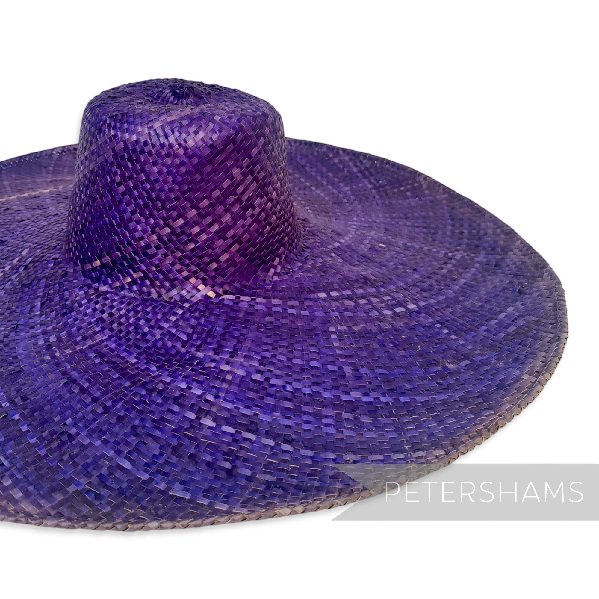 Petershams Millinery Supplies purple XL strip straw capeline hat body with a wide brim and stiff cane edge.