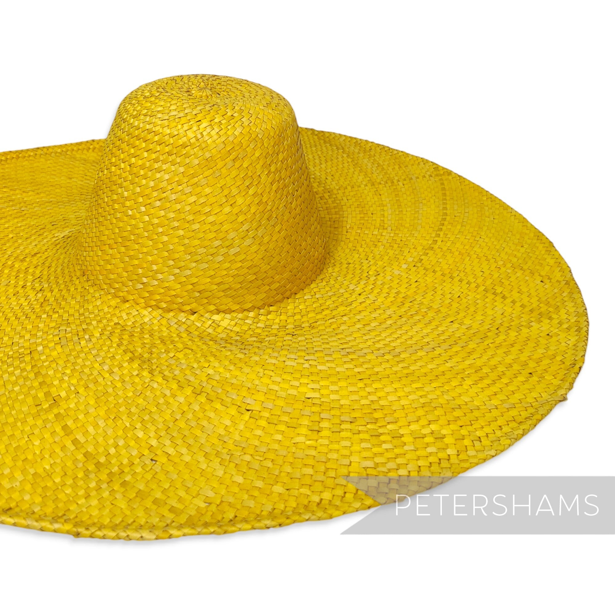 Petershams Millinery Supplies yellow XL strip straw capeline hat body with an extra wide brim and cane edge.