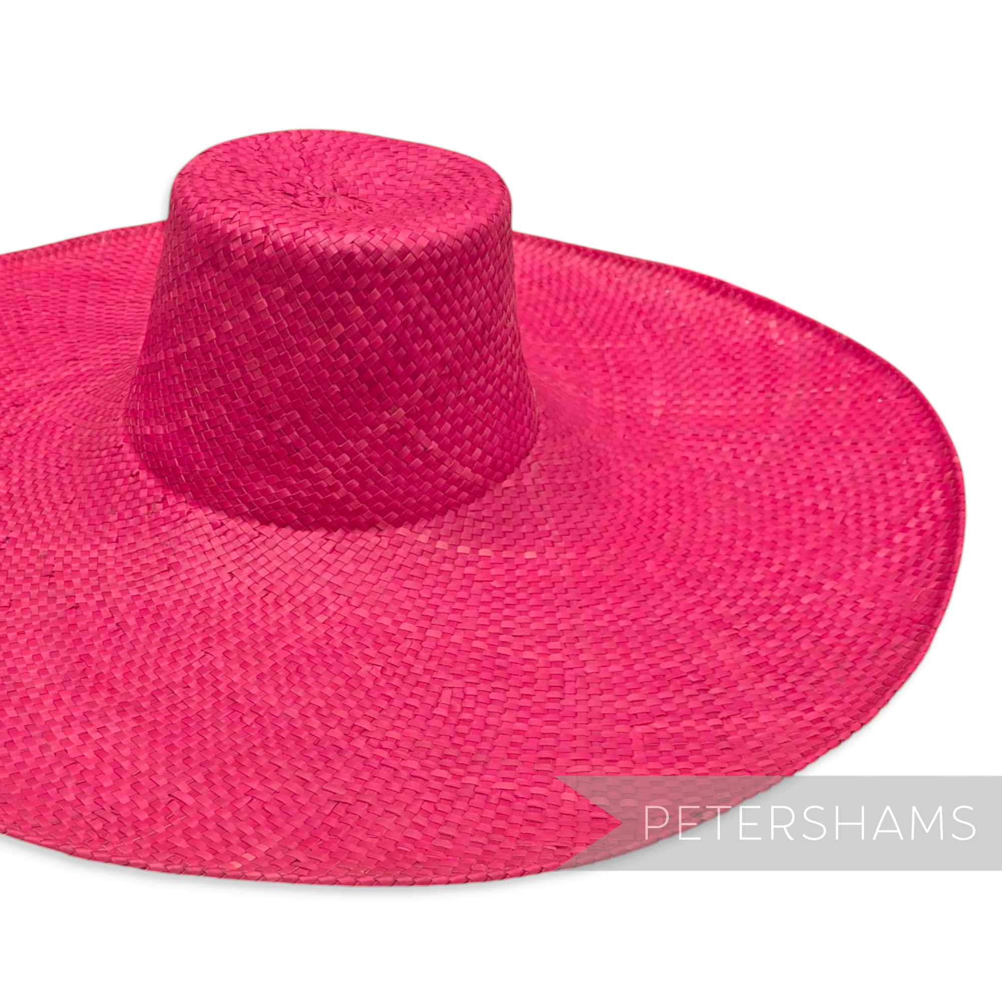 Petershams Millinery Supplies extra large hot pink straw capeline hat body with a wide brim and stiff cane edge