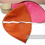 Petershams Millinery Supplies extra large double faced peachbloom fur felt hat cones in orange and pink with tape measure
