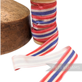 Petershams Millinery Supplies 23mm striped French velvet ribbon in red, white, and blue on a wooden spool