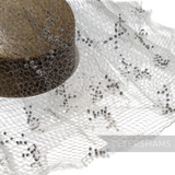 Petershams Millinery Supplies vintage 1930s honeycomb veiling round with black X-shaped dotted accents
