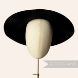 Petershams Millinery Supplies extra shiny black flat polybraid capeline hat body on a millinery head block