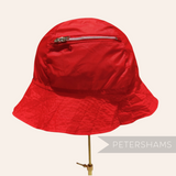 Petershams Millinery Supplies vintage red nylon children's bucket hat with a functional zippered storage pocket.