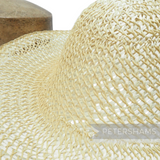 Petershams Millinery Supplies natural strip straw and twisted paper cord capeline hat body with open weave detail.