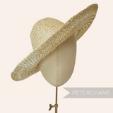 Petershams Millinery Supplies natural strip straw and twisted paper cord capeline hat body on a mannequin head