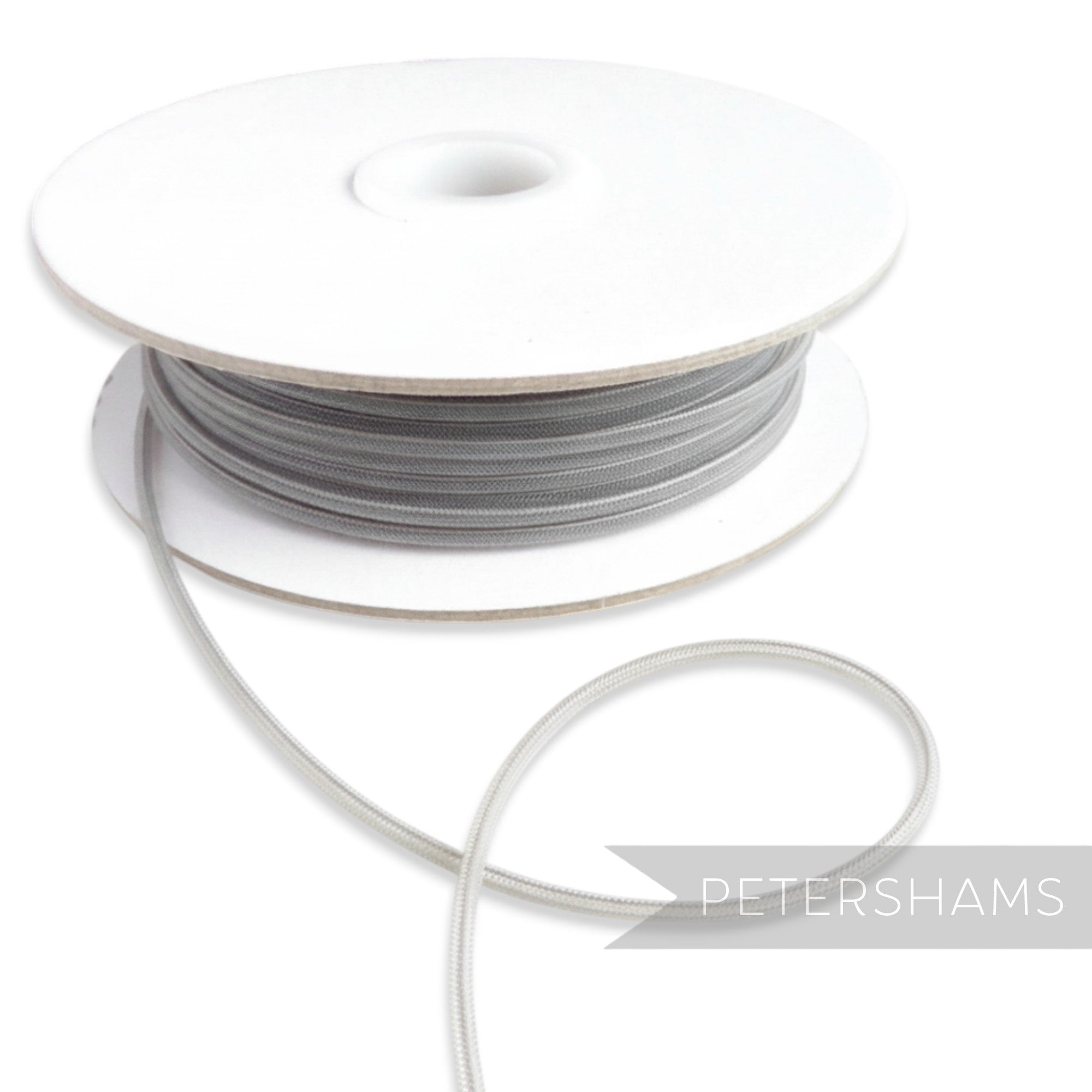 Petershams Millinery Supplies 2.5mm grey tubular crinoline trim with a central thread for gathering, sold by the metre.