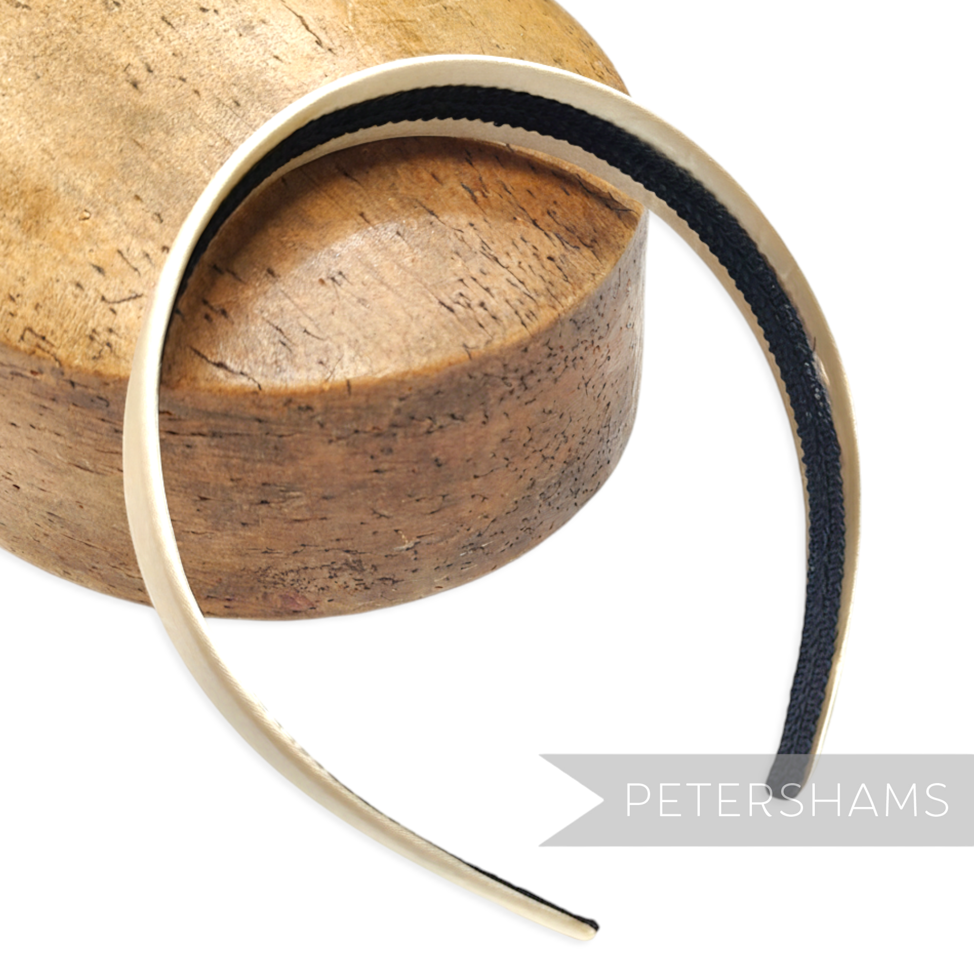 Petershams 24mm wide satin covered plastic headband with non-slip inner band, ideal for millinery.