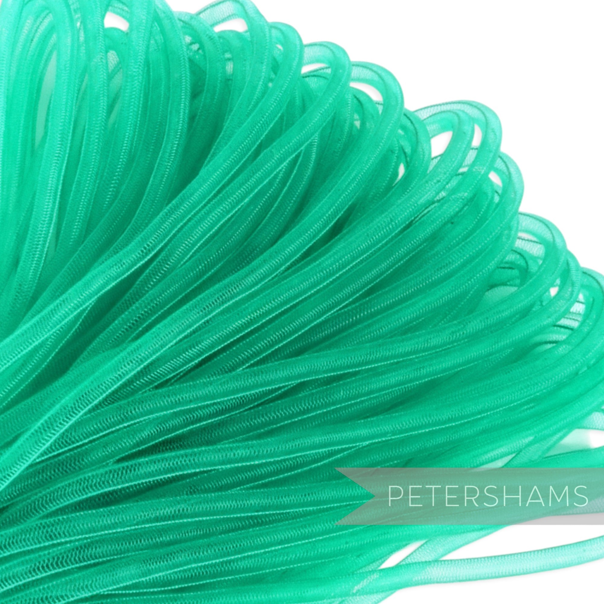 Petershams 6mm tube millinery crin in bright green, a sheer mesh trim for hat making and decorative accents.