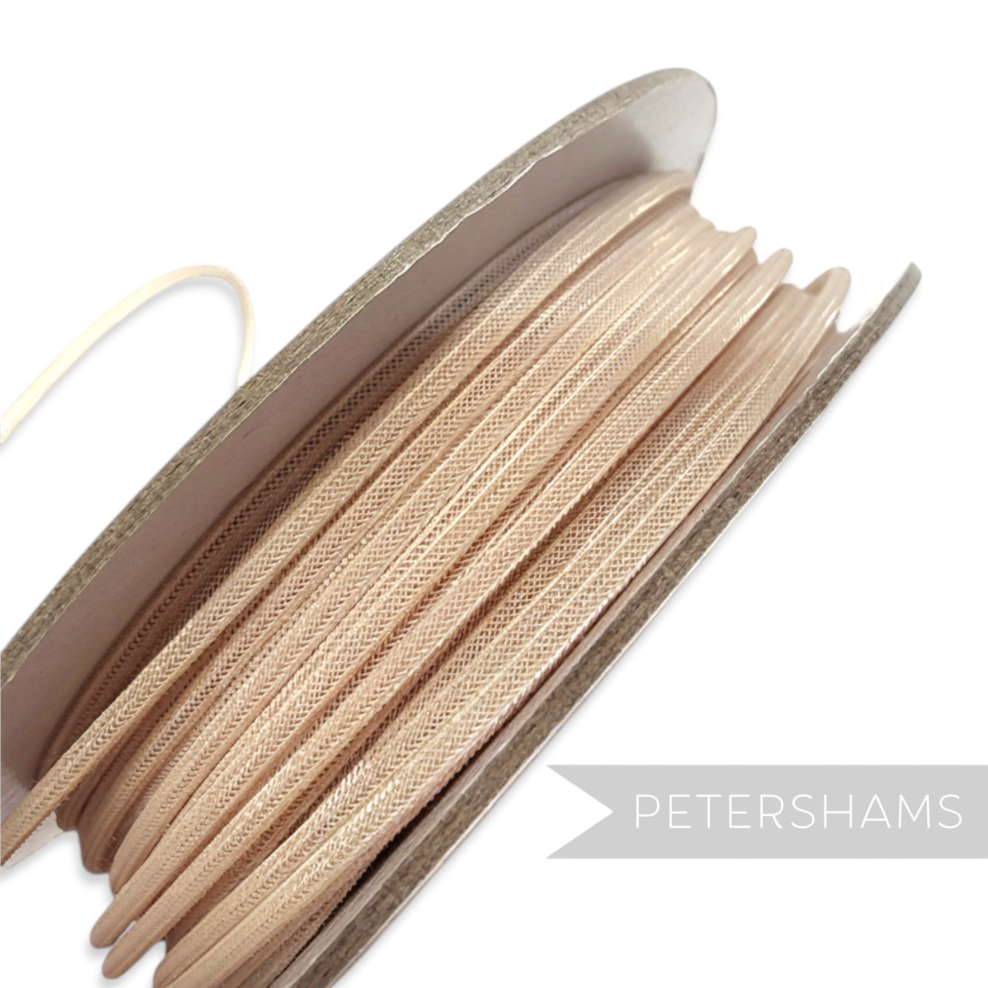 Petershams Millinery Supplies beige 2.5mm tubular crinoline netting on a spool, ideal for headbands and graphic shapes.