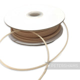Petershams Millinery Supplies beige 2.5mm tubular crinoline with central thread for headbands and graphic shapes.