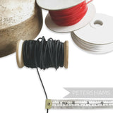Petershams black 2.5mm tubular millinery crinoline on wooden spool, perfect for headbands and graphic shapes.