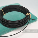 Petershams Millinery Supplies black 1.4mm cotton-covered steel wire for hat bases and forms.