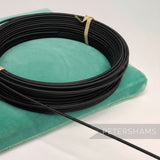 Petershams black 1.4mm cotton-covered millinery wire, ideal for hat bases and structural forms.