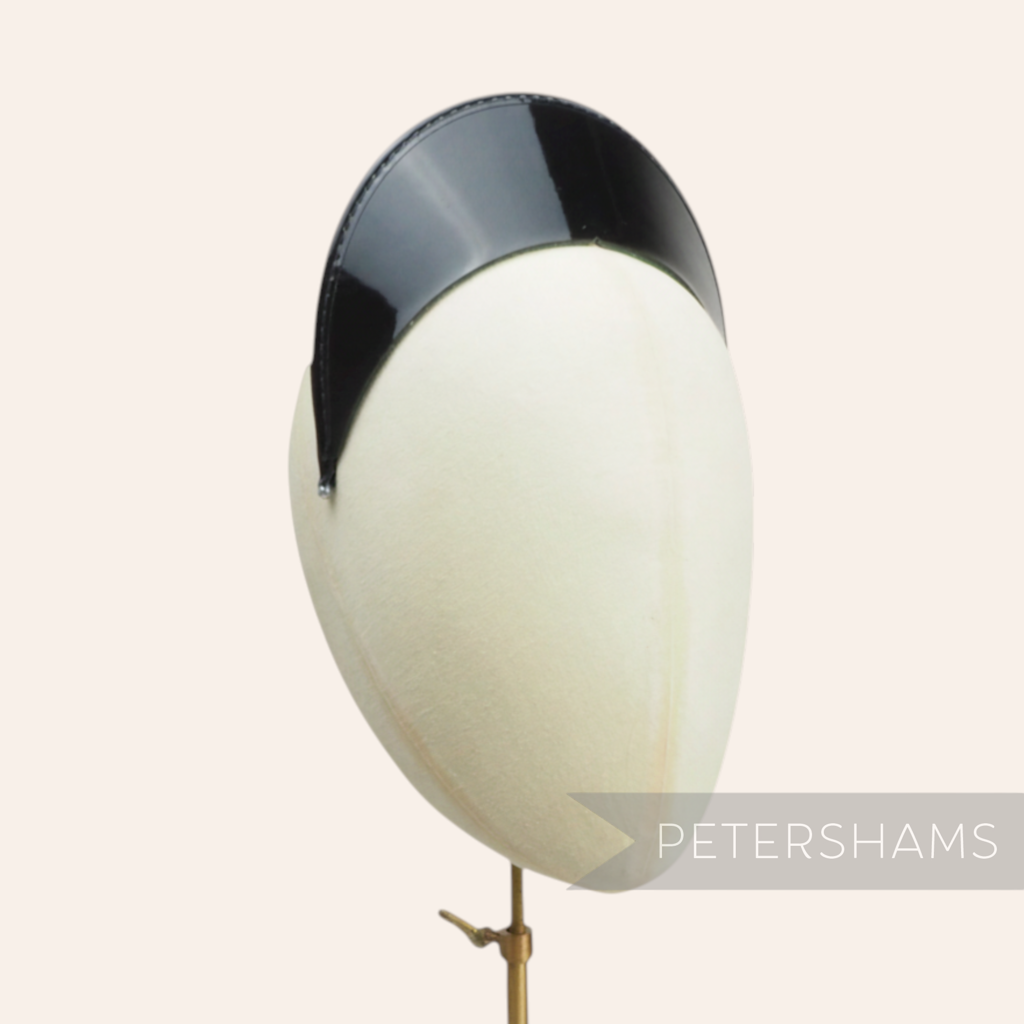 Petershams black patent leather cap peak with glossy top, pine green underside, and patent tape trim. Features a centre notch.