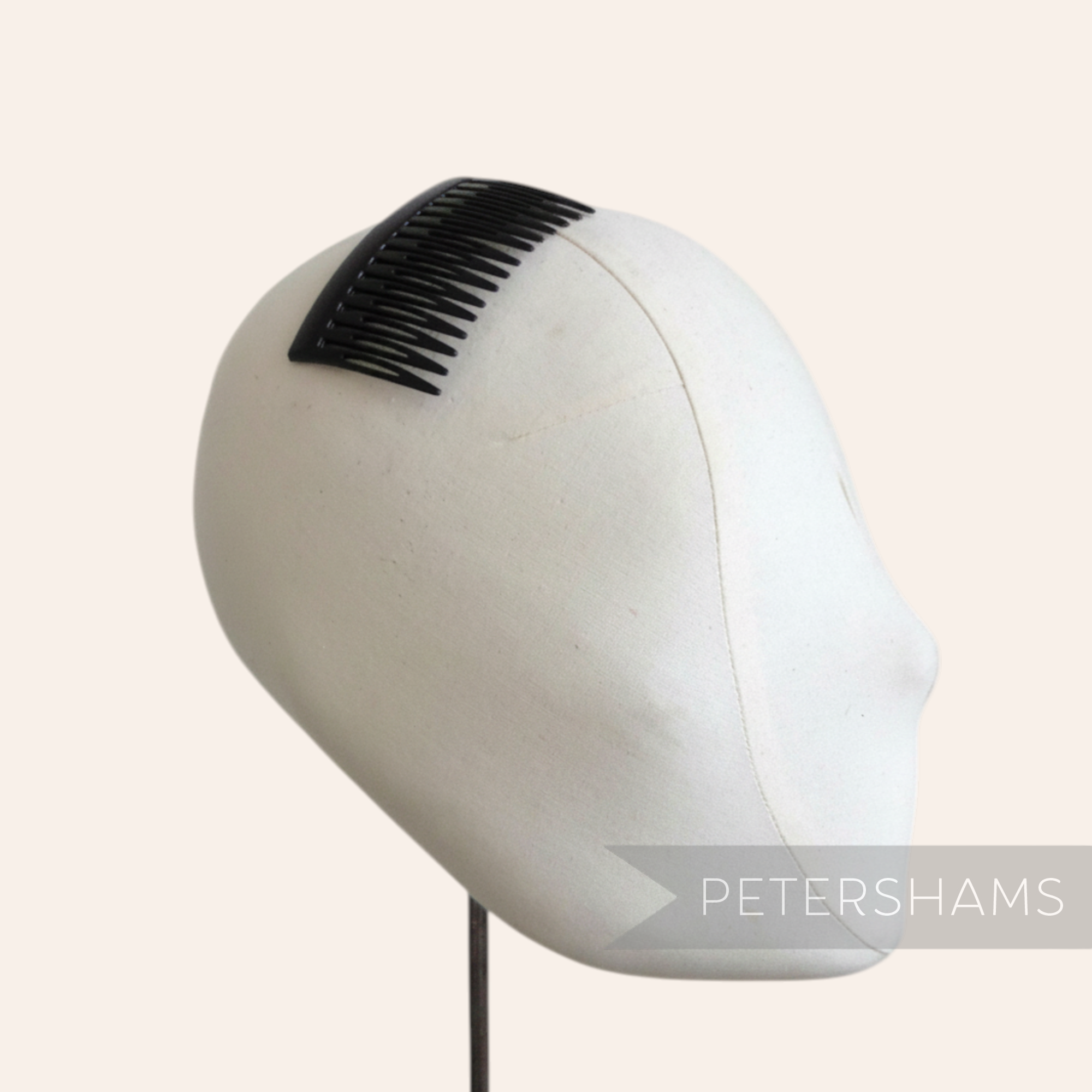 Petershams black 7cm plastic hair comb, ideal for sewing into hats and veils.