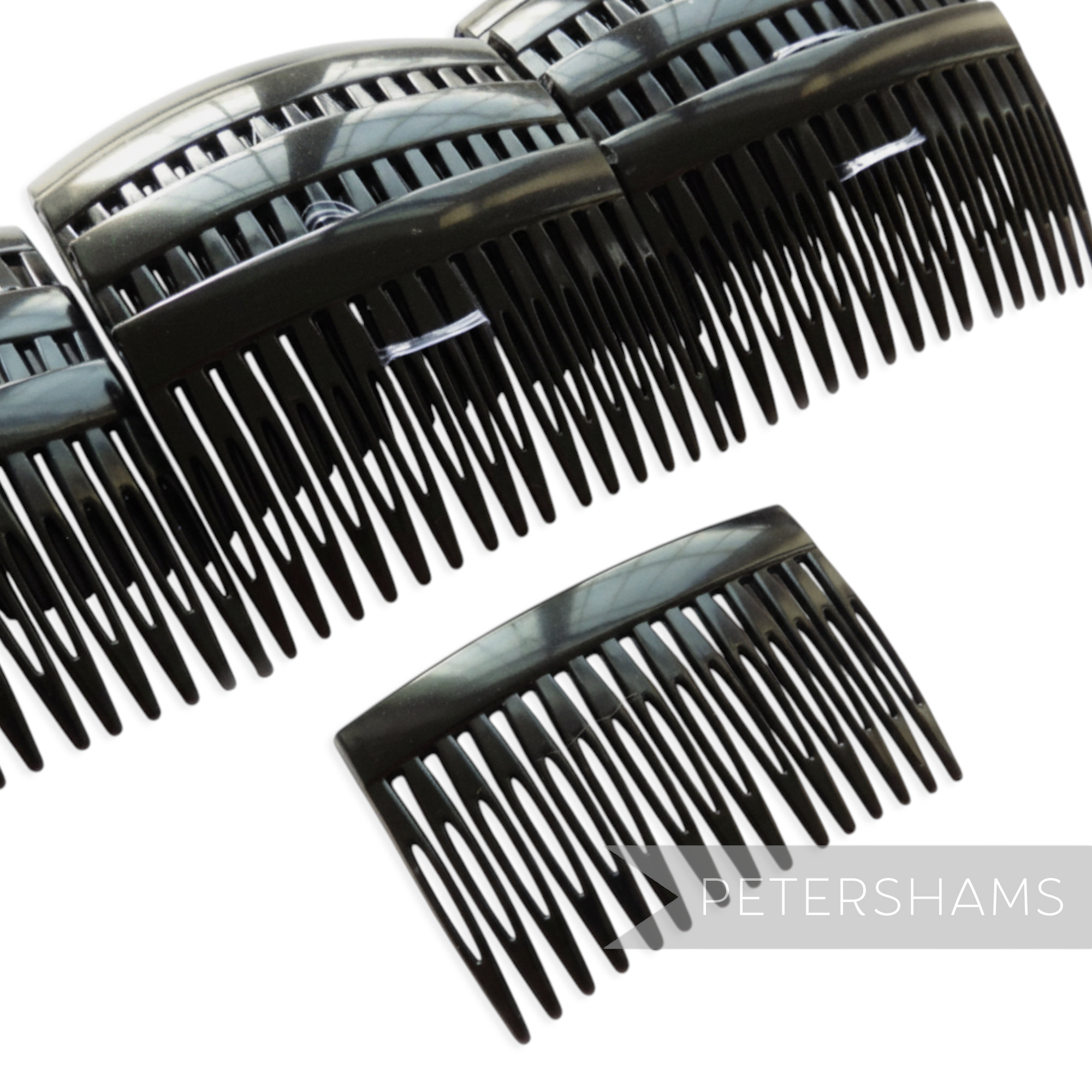 Petershams Millinery Supplies black plastic hair comb, 7cm wide, ideal for sewing into hats and veils.