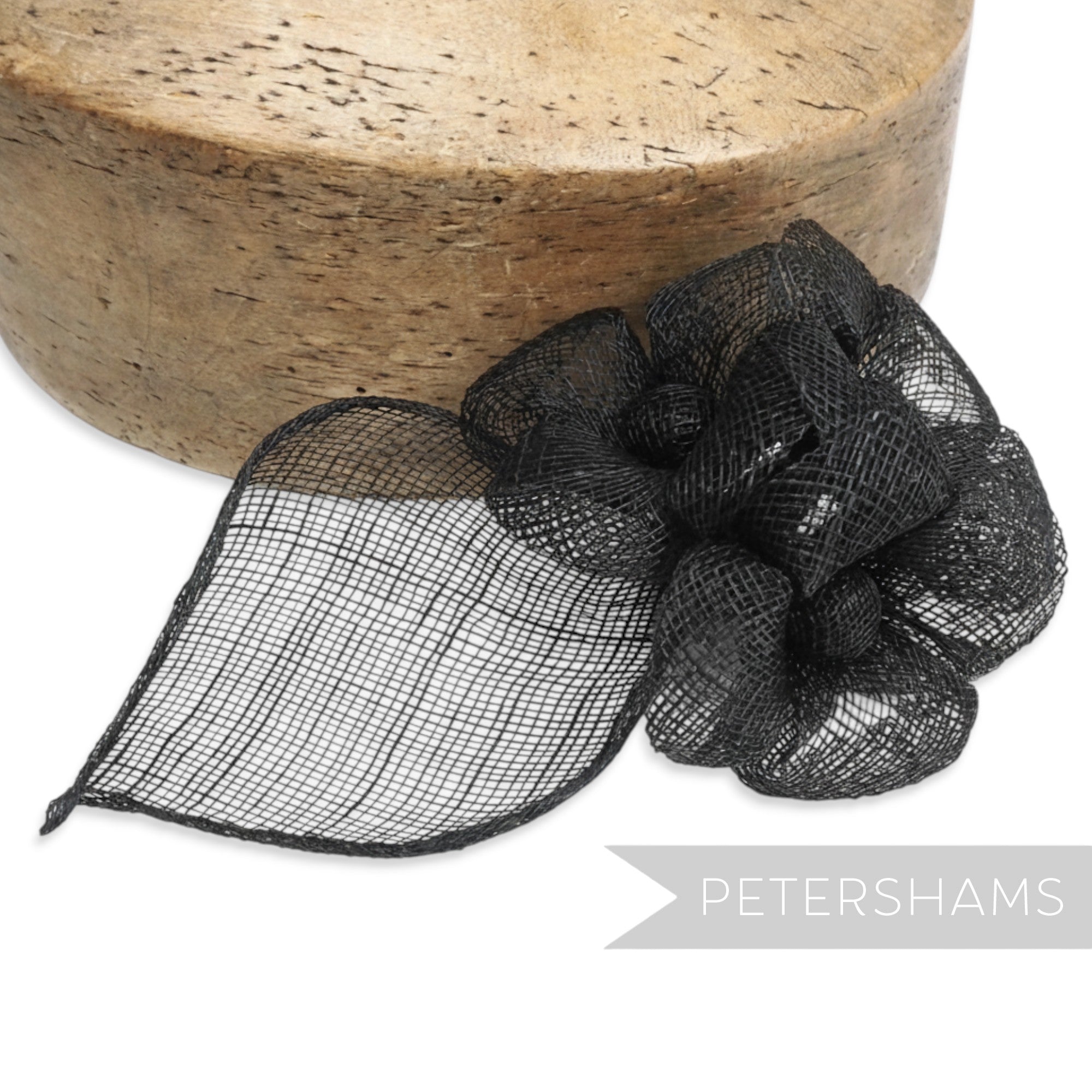 Petershams Millinery Supplies black sinamay triple flower hat mount with leaf backing.