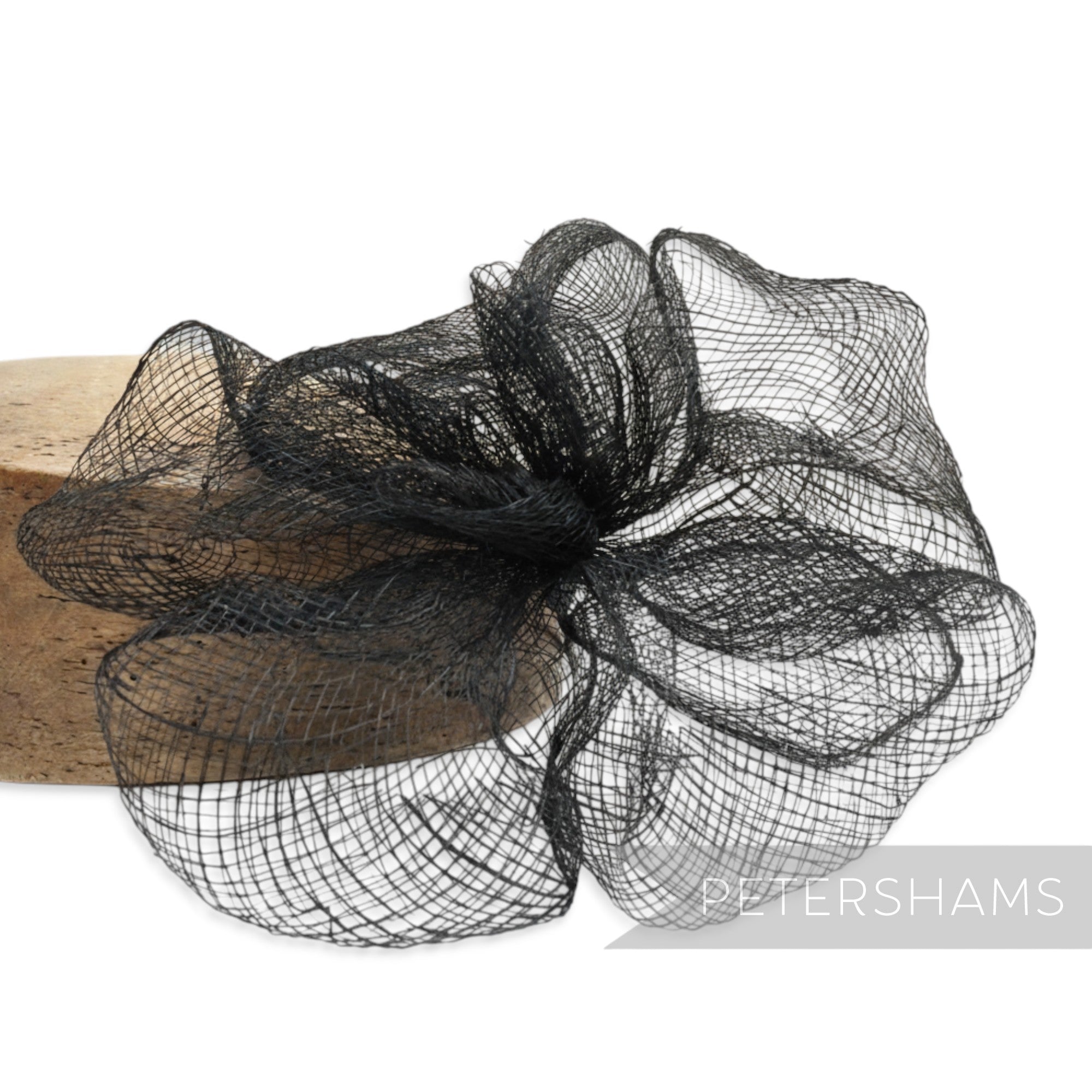 Petershams black sinamay frilly flower millinery mount, 20cm wide, with wired stem for shaping.
