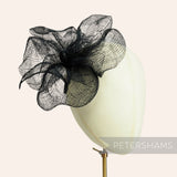 Petershams Millinery Supplies black sinamay flower mount with frilly petals and a single leaf, 20cm wide.