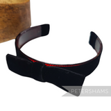 Petershams Millinery Supplies black velvet 25mm wide headband with a bow and red lining. Vintage 1960s style.