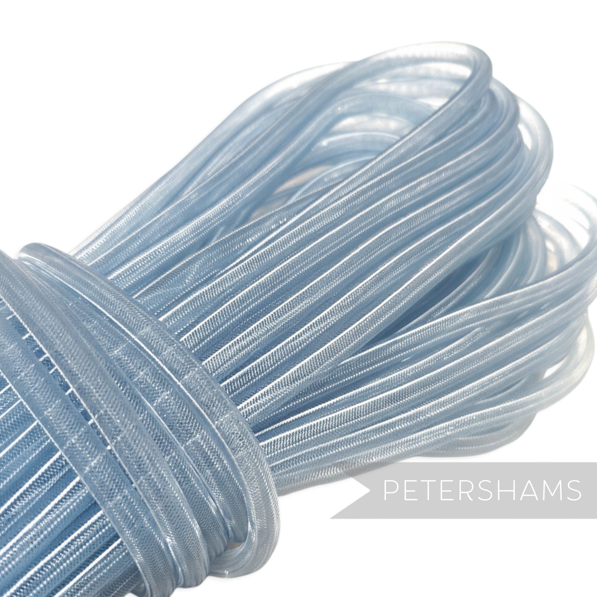 Petershams light blue 8mm tube millinery crin for hat making and trims, slightly sheer with gathered threads.