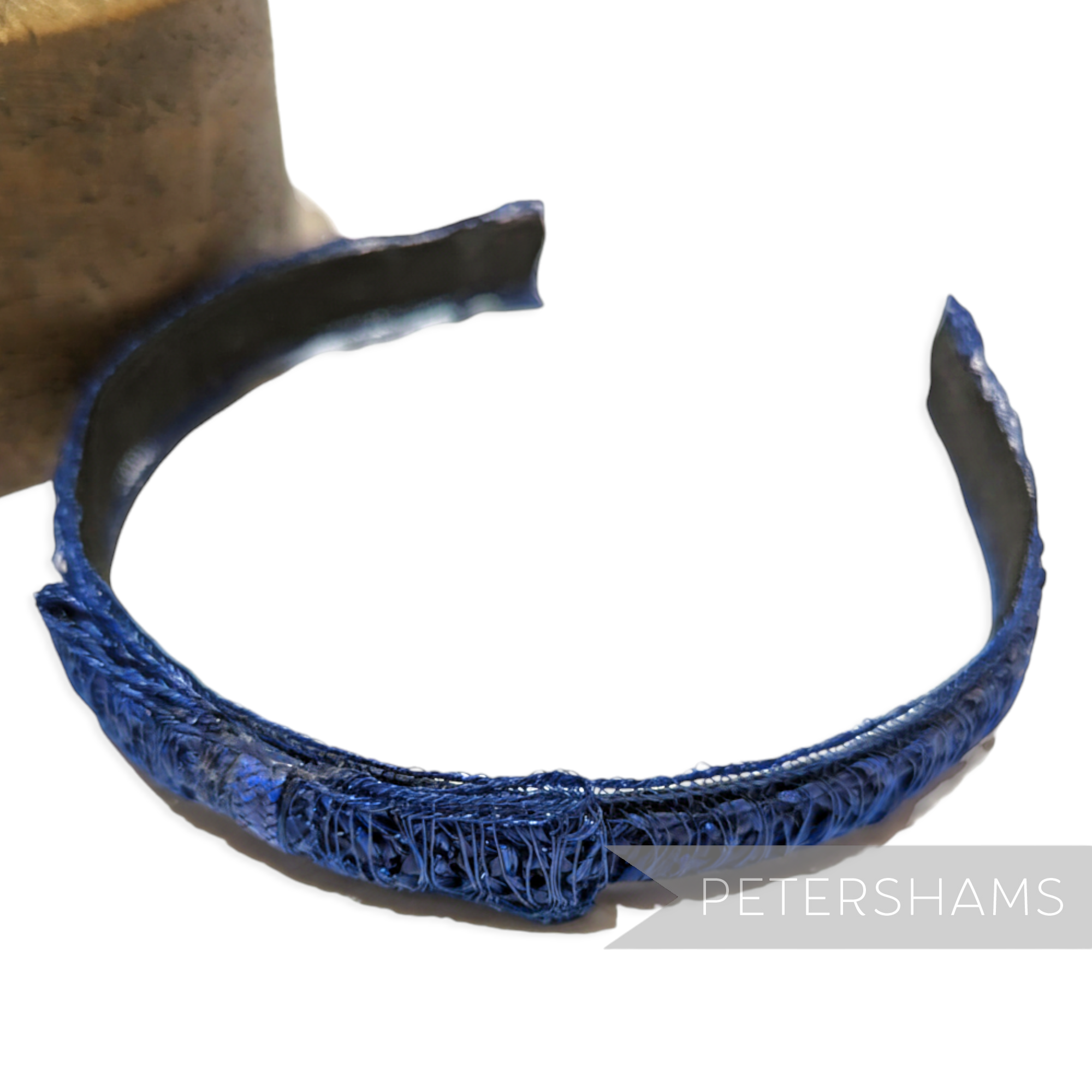Petershams blue laminated raffia and crin braid headband with a small bow detail, 1960s style.