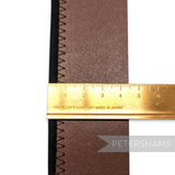 Petershams Millinery Supplies brown bonded leather hat band with black stitching and a ruler measuring width.