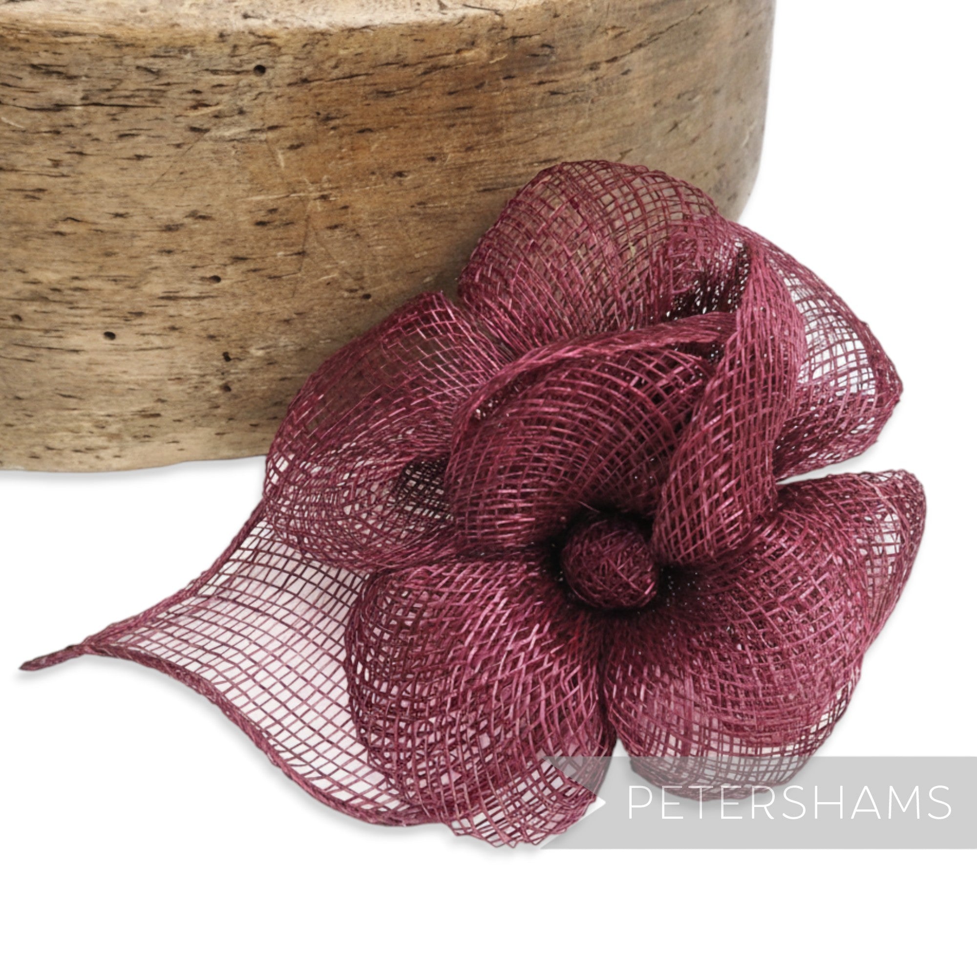 Petershams Millinery Supplies burgundy sinamay triple flower hat mount with leaf backing.