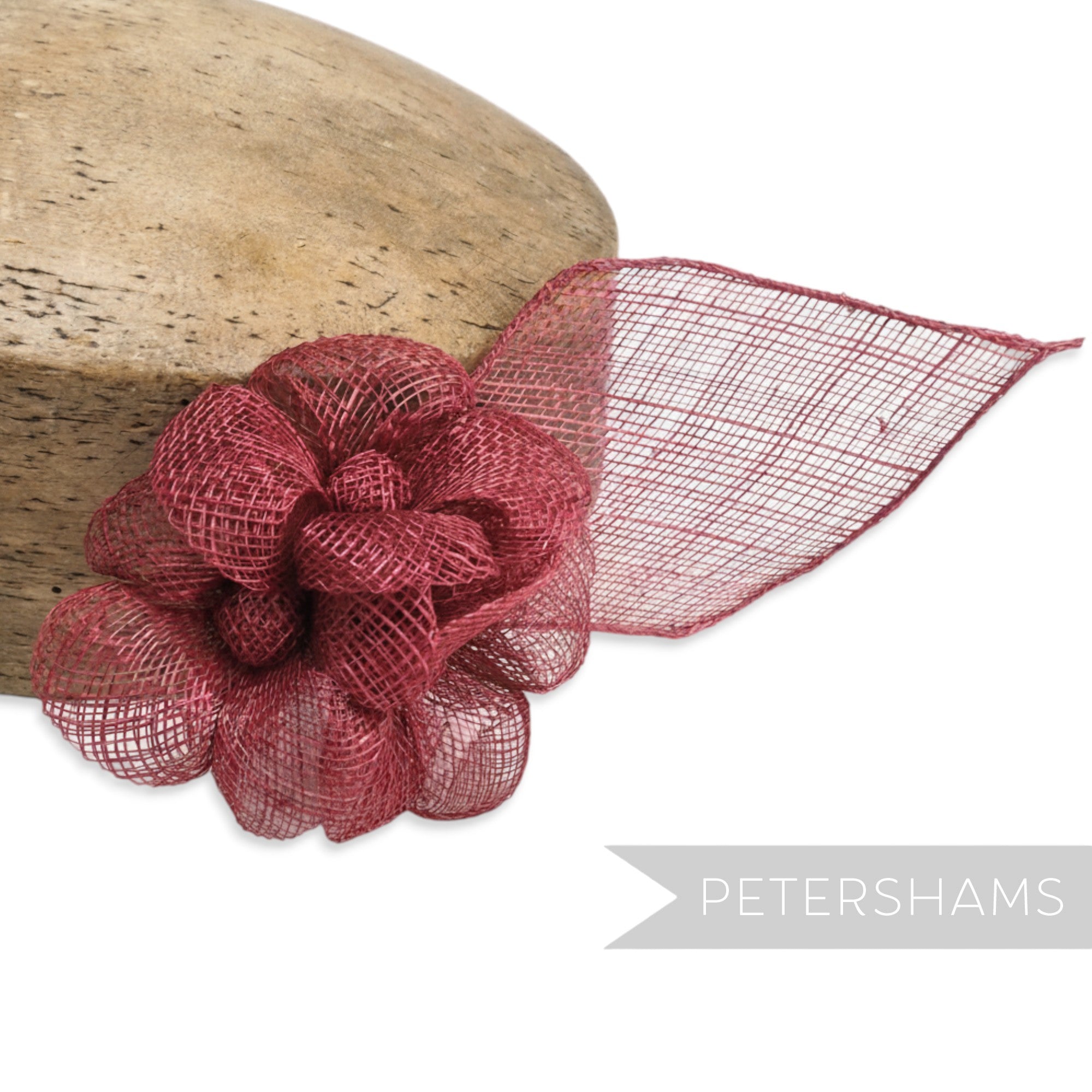 Petershams Millinery Supplies burgundy sinamay triple flower hat mount with leaf backing.