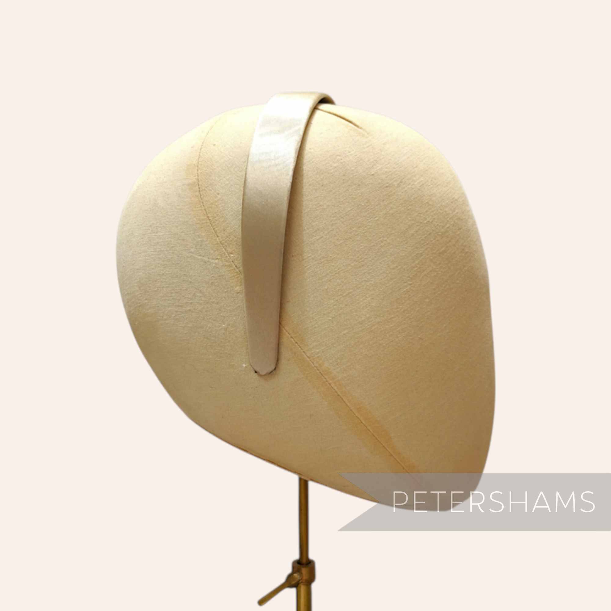 Petershams champagne satin covered plastic headband, 24mm wide, ideal for millinery.