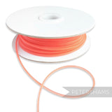 Petershams Millinery Supplies coral 2.5mm tubular crinoline trim with a central thread for gathering.