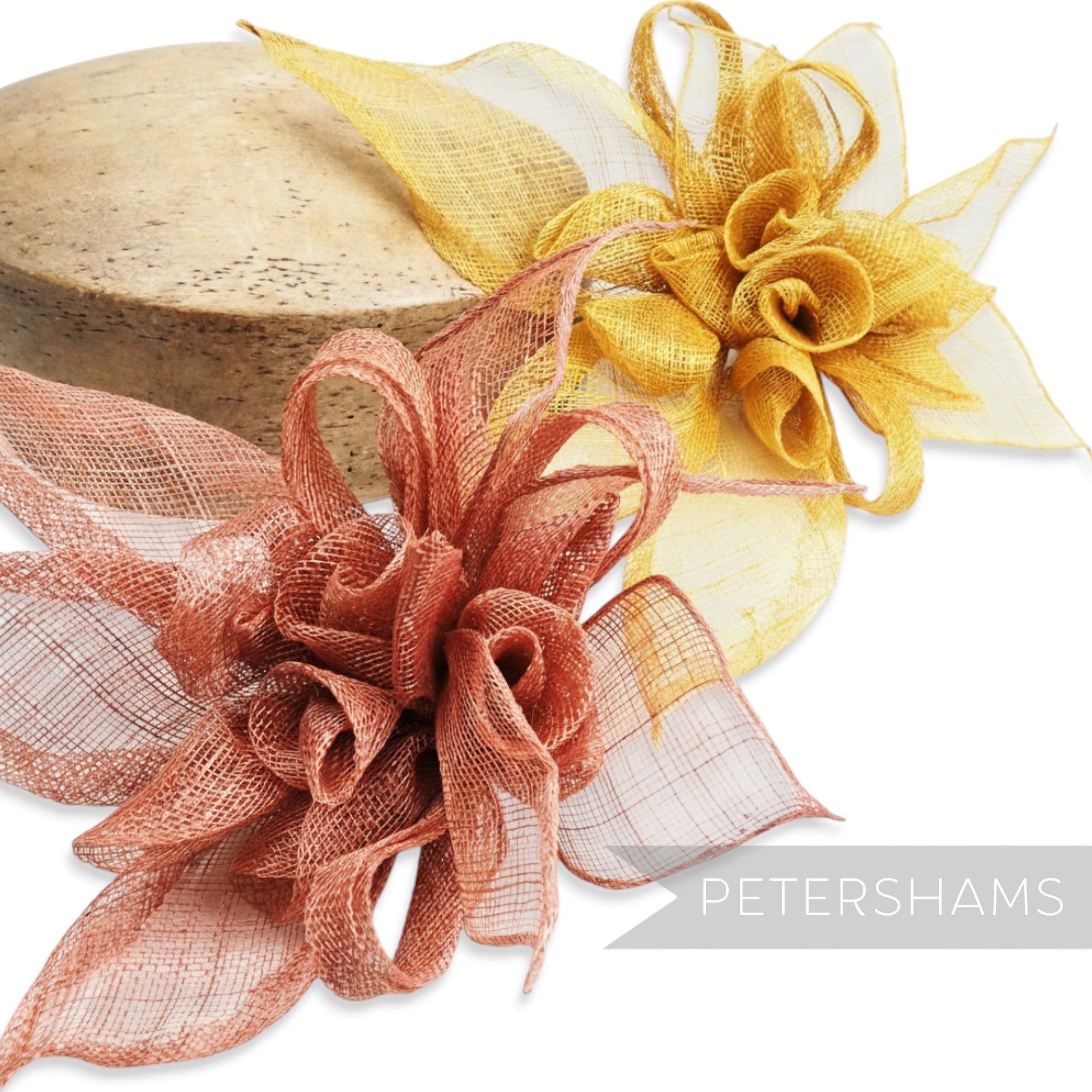 Petershams Millinery Supplies large layered sinamay flower hat mount in coral and gold, featuring rolled blossoms and leaves.