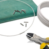 Petershams dark silver wire joining ferrules for millinery hat wire, shown with wire and cutters.