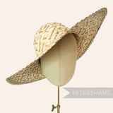 Petershams 'Emmy' natural multitone strip straw capeline hat body with decorative folded edge brim, 12-inch diameter.