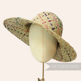 Petershams Millinery Supplies natural straw capeline hat body with woven pink, purple, and jade rope details. 11-inch brim.