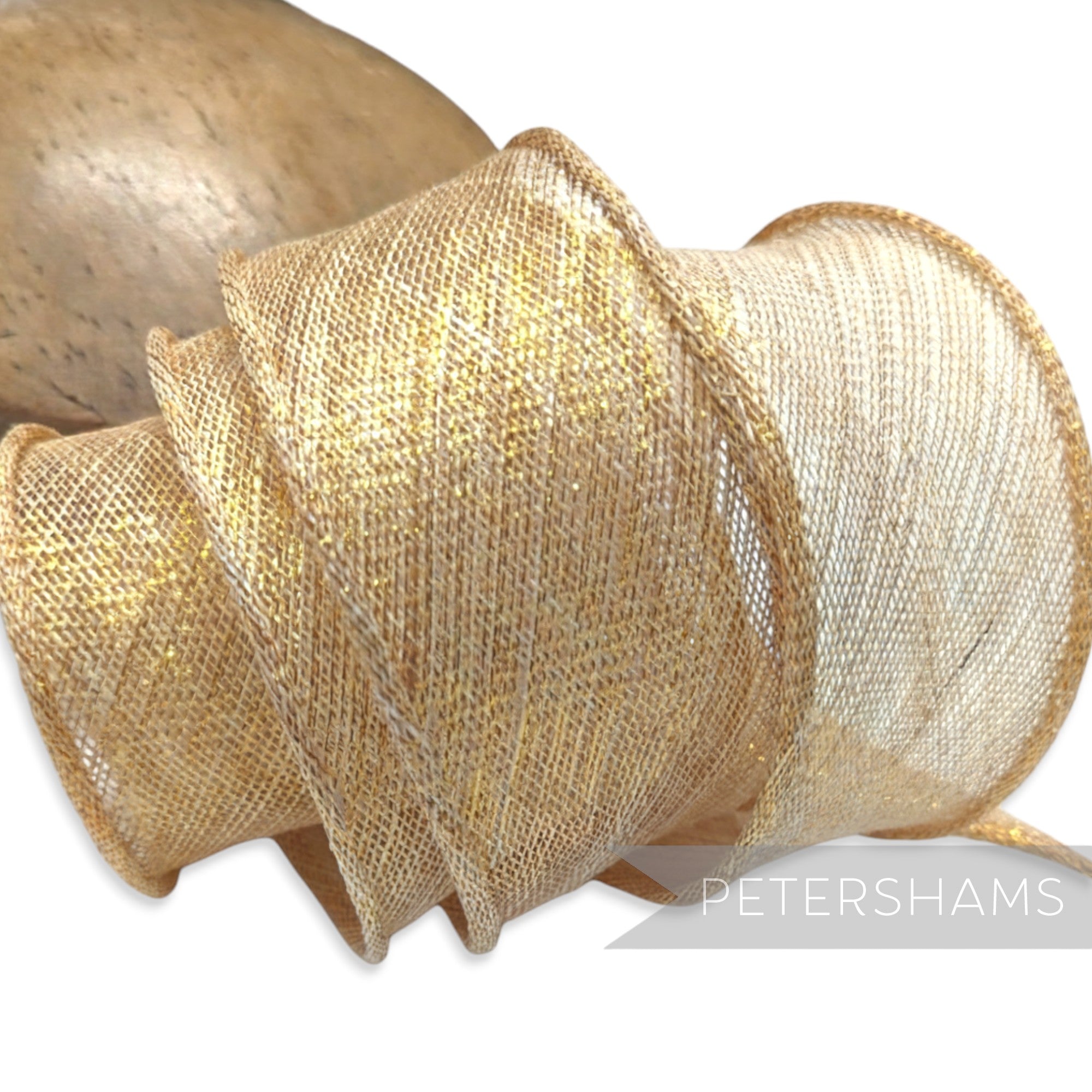 Petershams Millinery Supplies gold metallic lurex sinamay ribbon trim, hand-rolled edges, tapered ends, ideal for hat making.