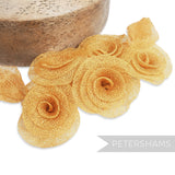 Petershams Millinery Supplies gold sinamay flower and leaf hat mount. Made from sinamay abaca fabric with a flat backing.