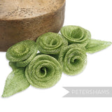 Petershams Millinery Supplies green sinamay flower and leaf hat mount, 20cm wide.