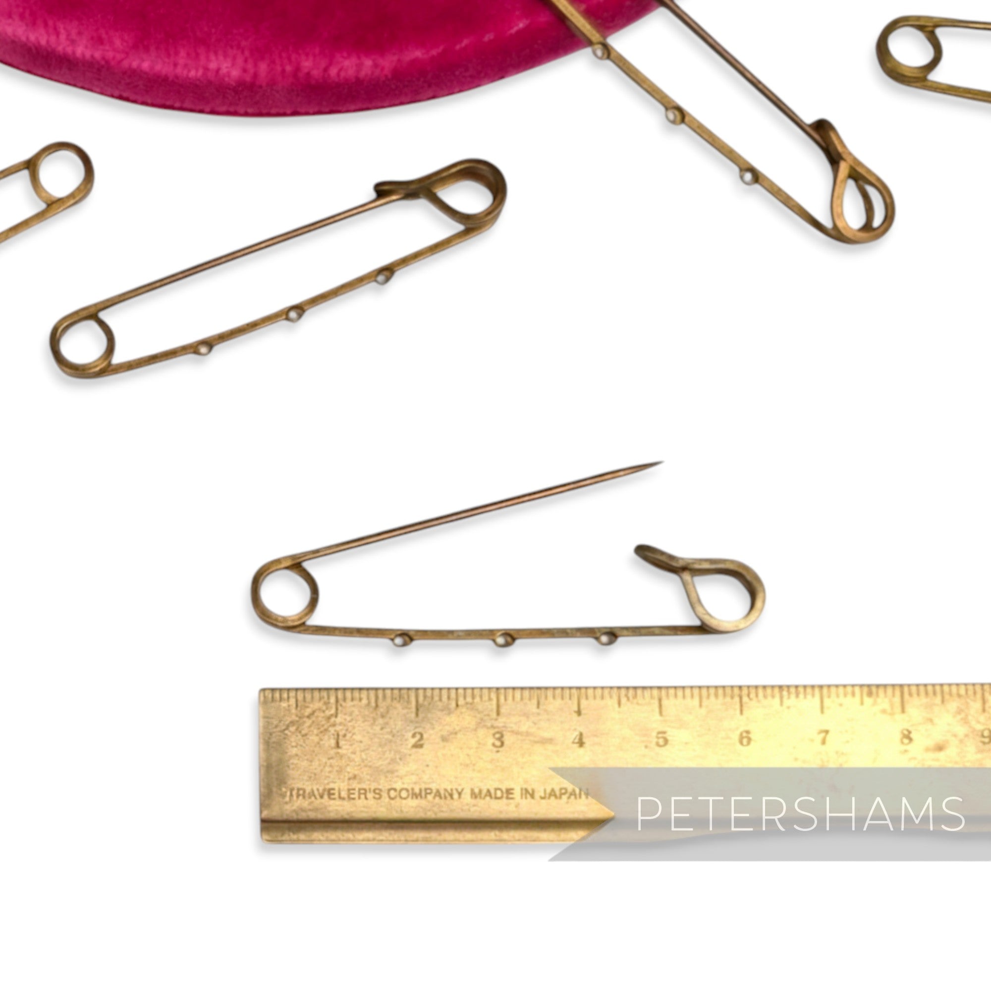 Petershams Millinery Supplies large 62mm vintage brass safety pin with 3 sewing holes, ideal for embellishing hats and headpieces.